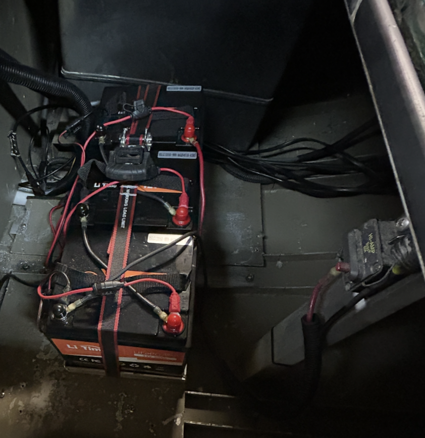 Three LiTime 50Ah lithium batteries installed in an outboard jet boat