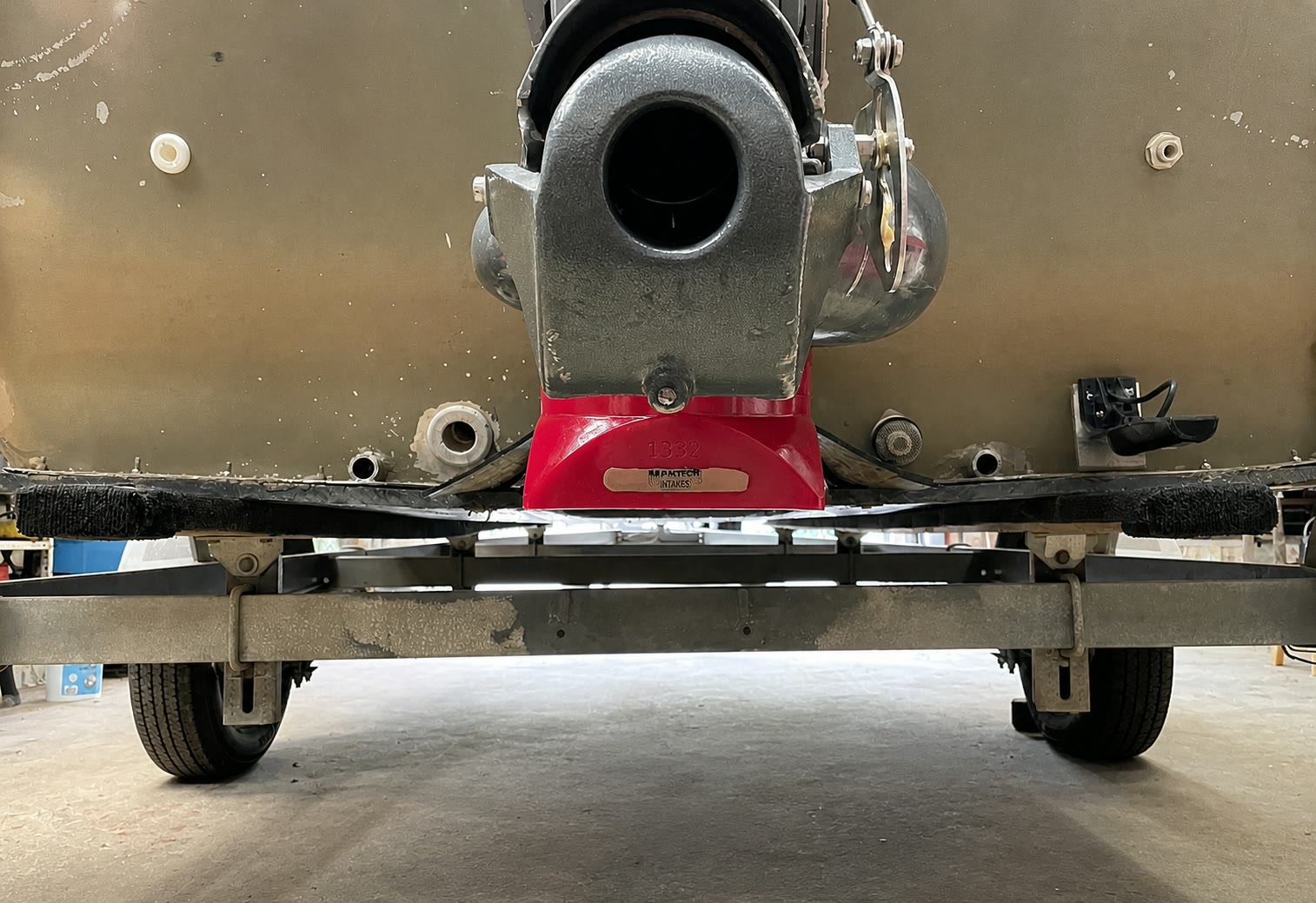 Rear underside view of an aluminum boat with its outboard jet intake tucked into the jet tunnel