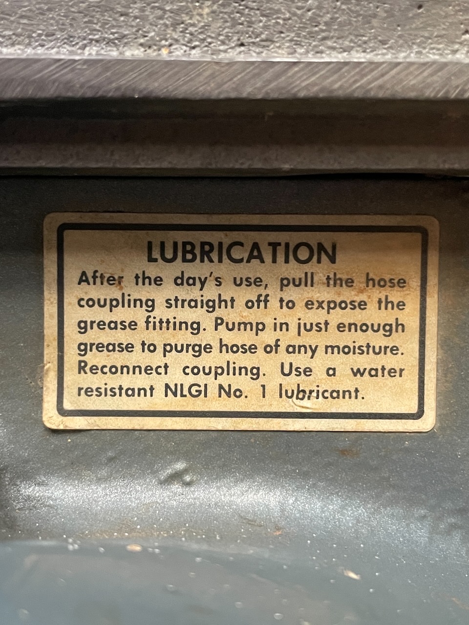 Lubrication instructions sticker mounted on the side of an outboard jet