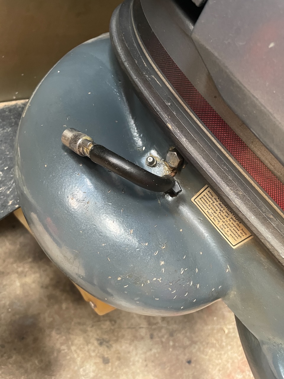 Outboard jet vent hose coupling disconnected from the grease fitting